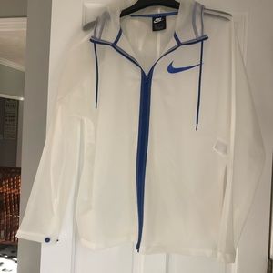 Nike Jacket. Clear- Blue Trim and Blue Logo.Mens Medium.Perfect condition